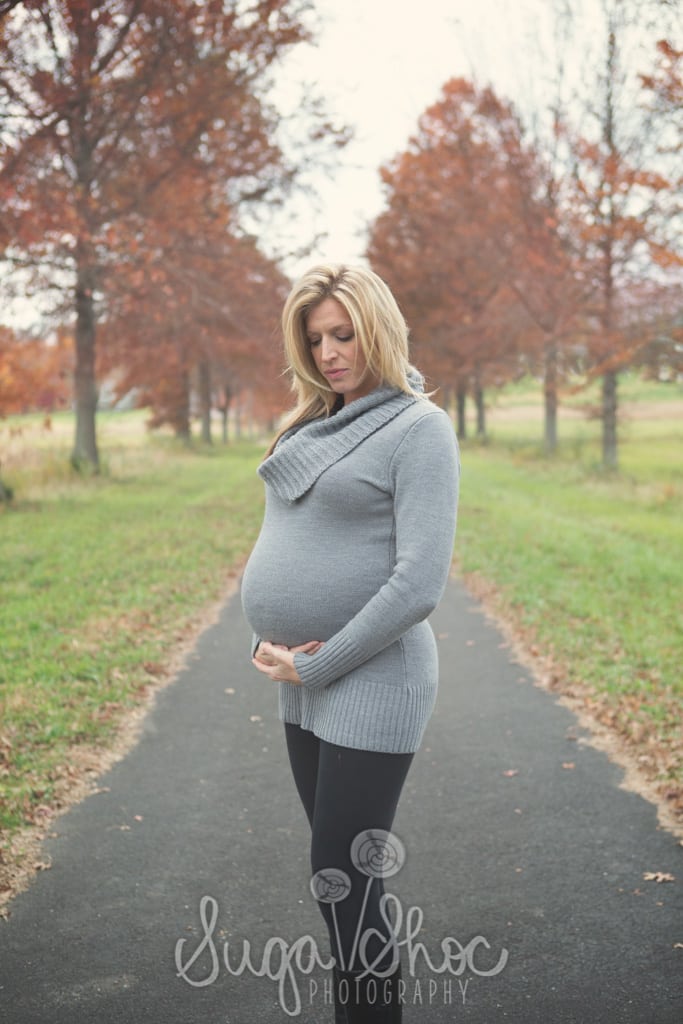 SugaShoc_Photography_Maternity_Photographer_Bucks County_Doylestown_PA_posed_by_trees_holding_belly