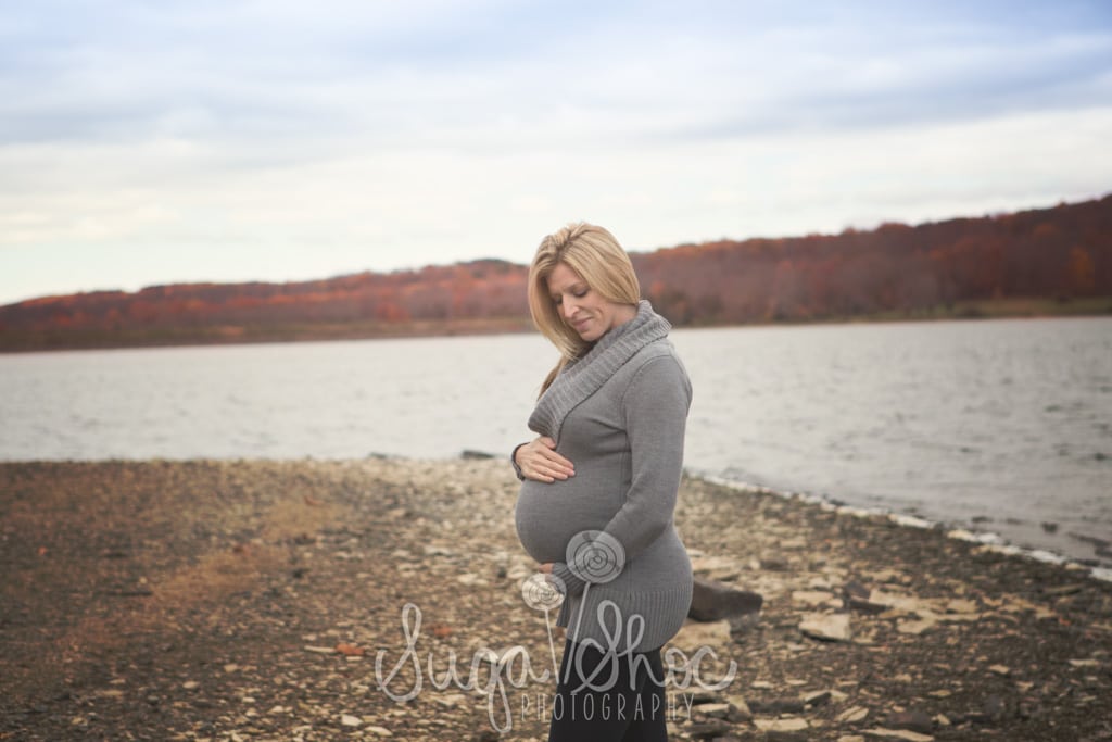 SugaShoc_Photography_Maternity_Photographer_Bucks County_Doylestown_PA_posed_by_water_holding_belly