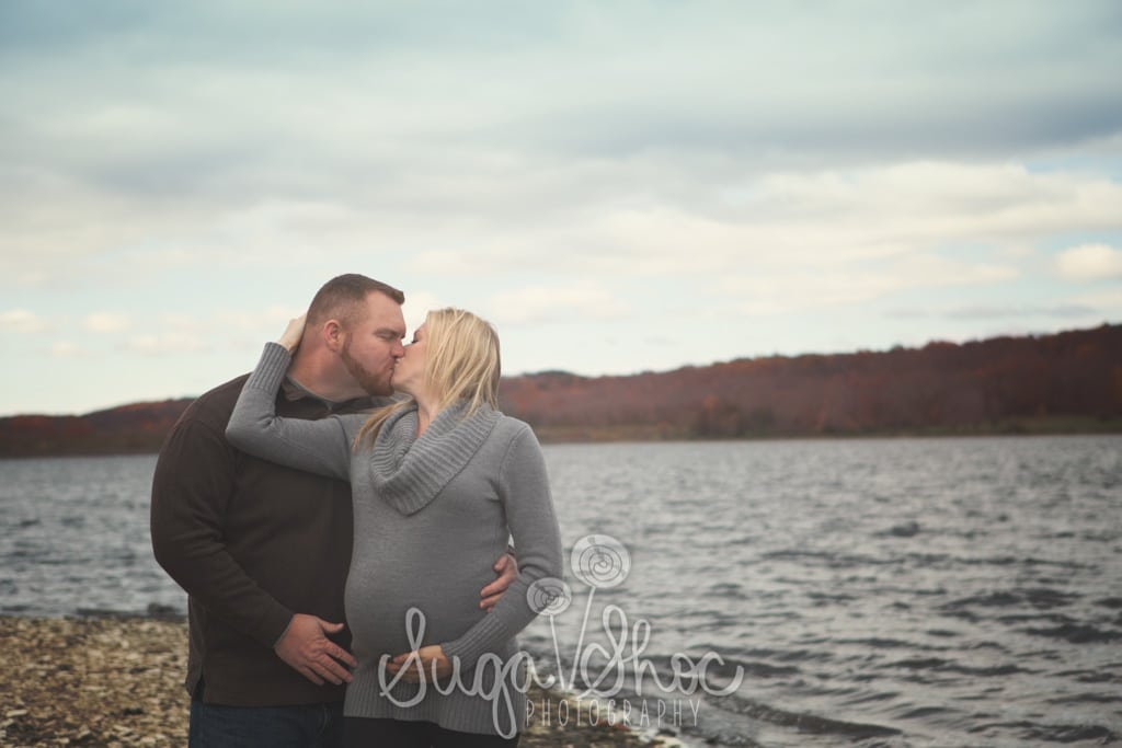 SugaShoc_Photography_Maternity_Photographer_Bucks County_Doylestown_PA_couple_posed_by_water_kissing