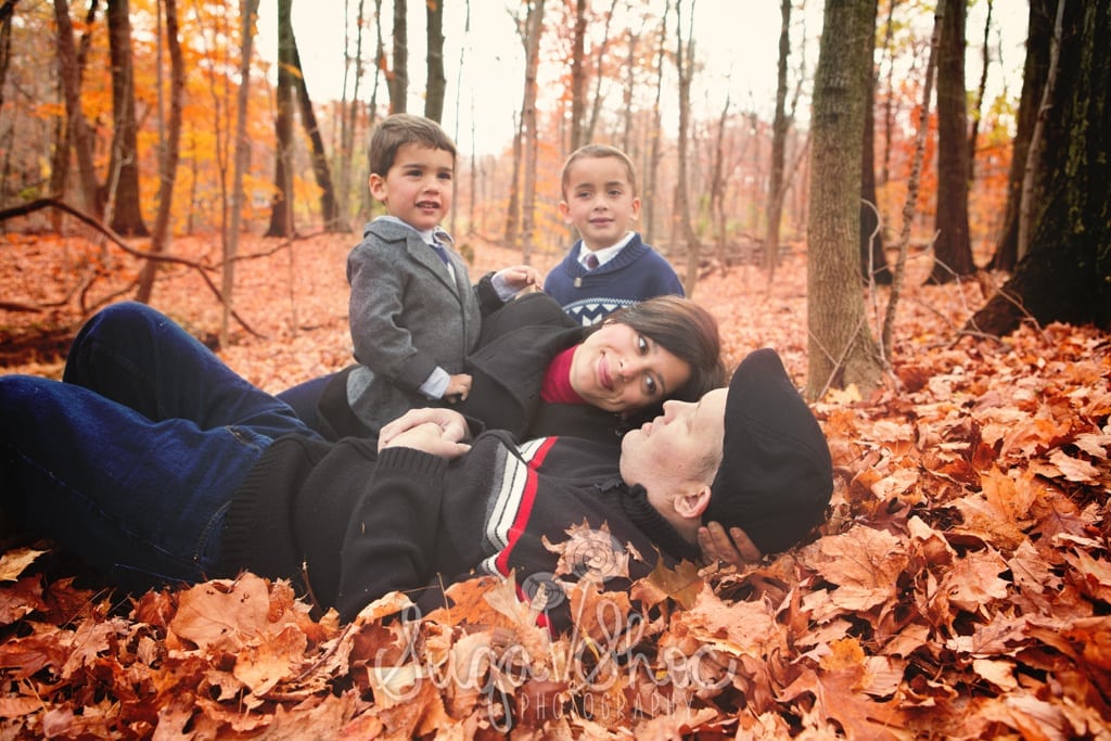 SugaShoc_Photography_Family_Photographer_Bucks County_Doylestown_PA_family_posed_with_fall_leaves_outdoors