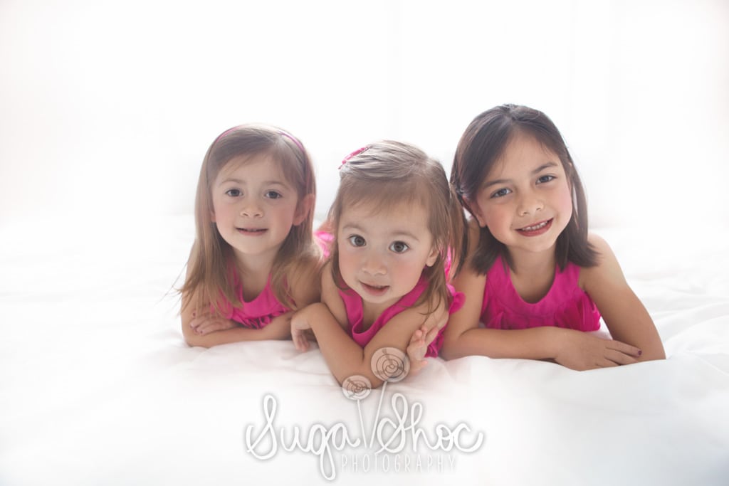 SugaShoc_Photography_Children_Photographer_Bucks County_Doylestown_PA_sisters_laying_on_bed