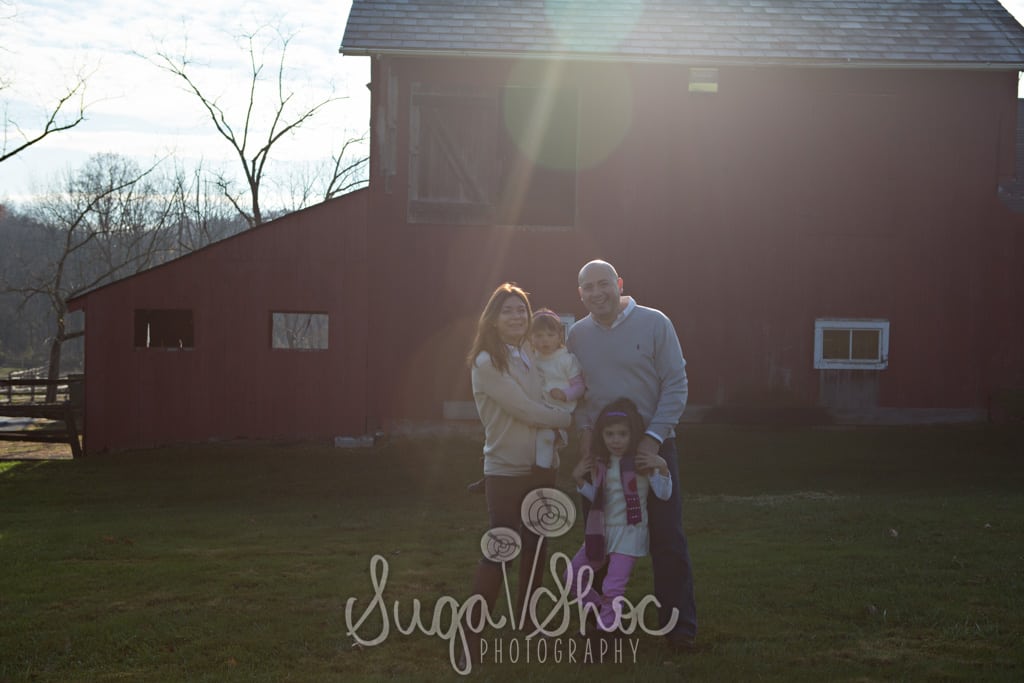 SugaShoc_Photography_Family_Photographer_Bucks County_Doylestown_PA_mini_session_outdoor_family_posed_in_front_of_red_barn