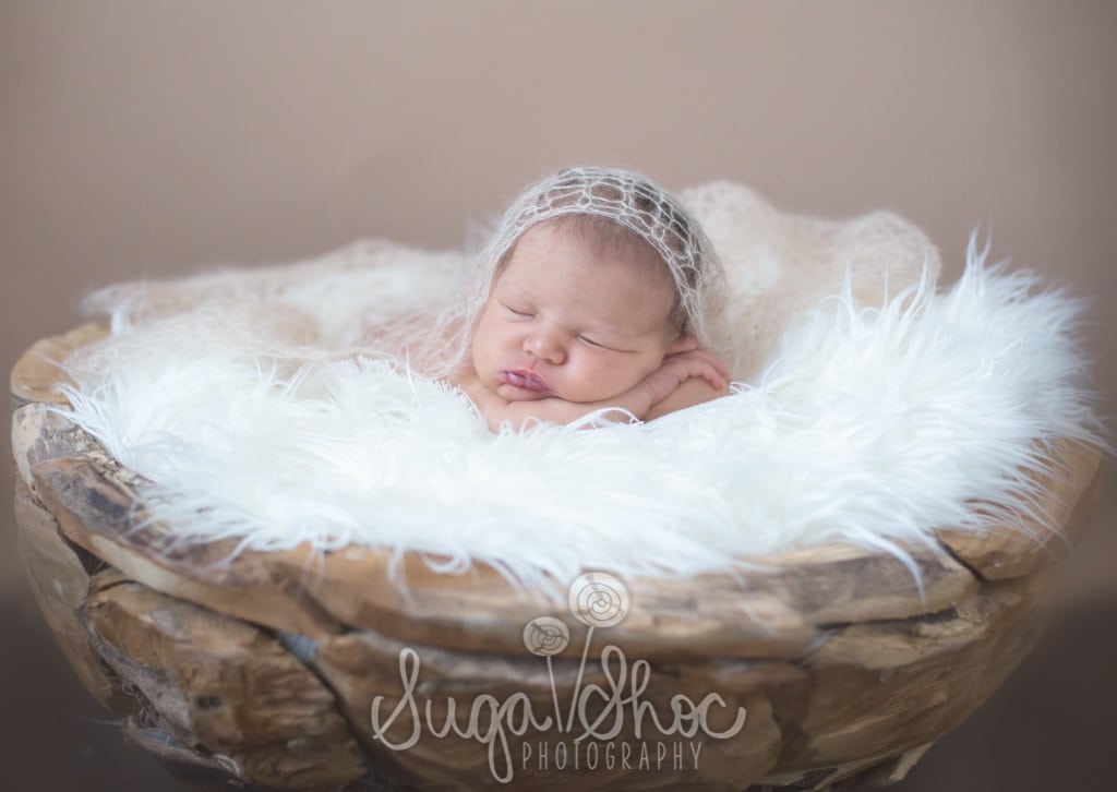 SugaShoc_Photography_Newborn_Photographer_Bucks County_Doylestown_PA_newborn_in_wooden_puzzle_bowl_on_white_flocati