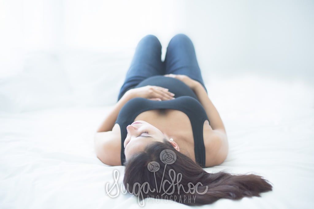 SugaShoc_Photography_Maternity_Photographer_Bucks County_Doylestown_PA_posed_laying_down_on_back_hands_on_belly