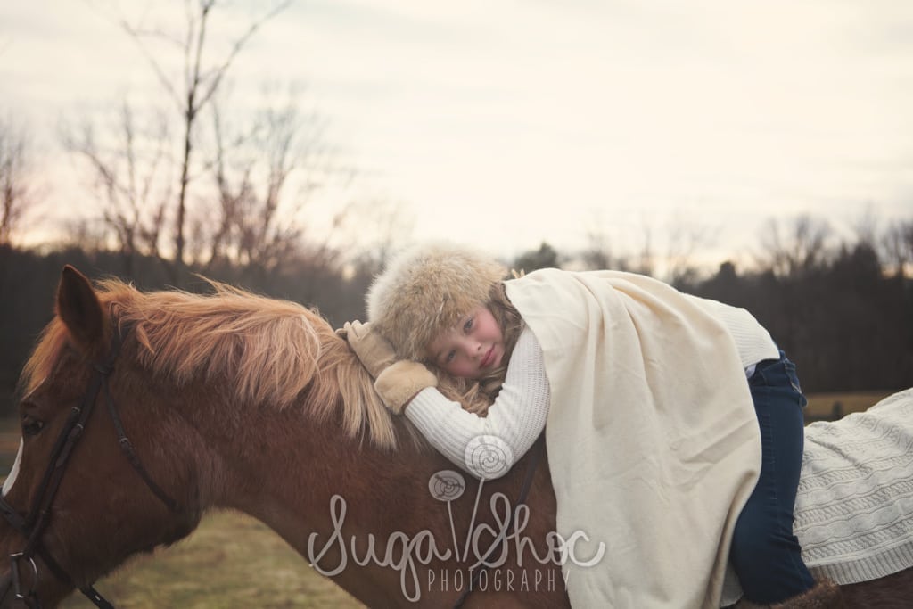 SugaShoc_Photography_Family_Children_Photographer_Bucks County_Doylestown_PA__girl_with_fur_hat_outdoor_riding_horse
