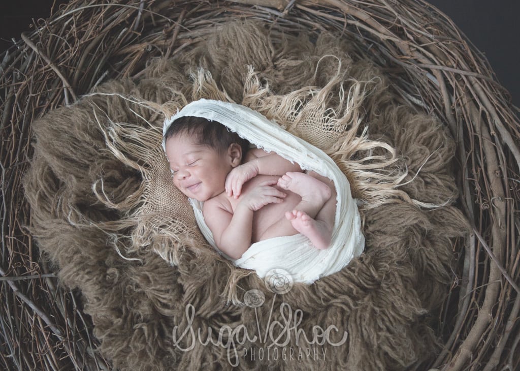 SugaShoc_Photography_Newborn_Photographer_Bucks County_Doylestown_PA_newborn_in_nest_smiling