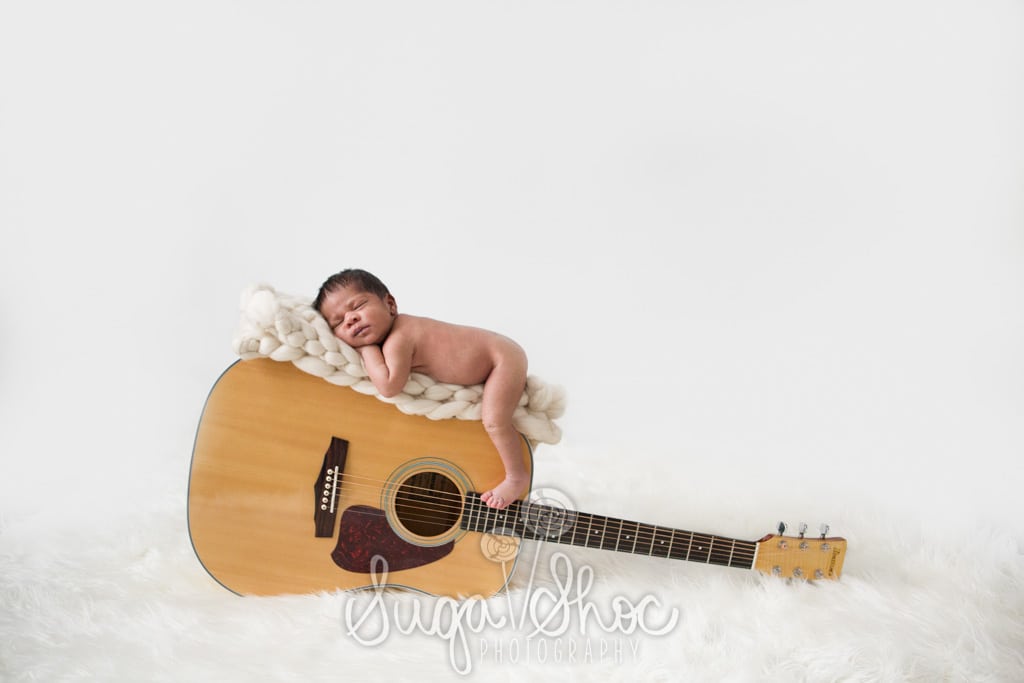 newborn on guitar composite