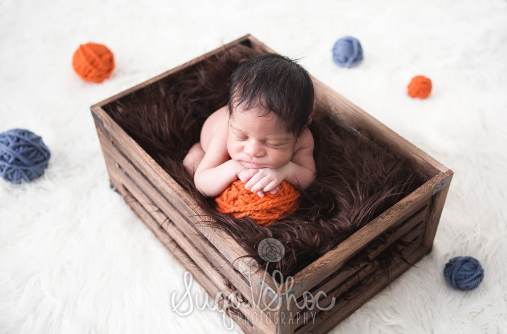SugaShoc_Photography_Newborn_Photographer_Bucks County_Doylestown_PA_newborn_in_crate_on_ball_of_yarn