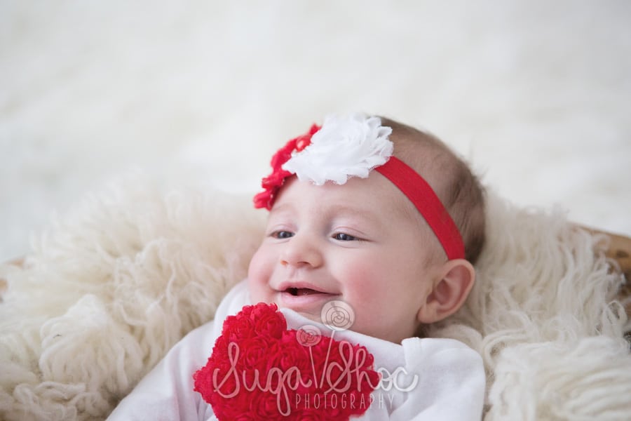 Smiling baby photograph for valentine's day mini session in bucks county pa