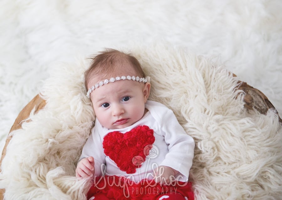 baby photograph with sleepy shimmer hair tie on flokati for valentine's day mini session in bucks county pa