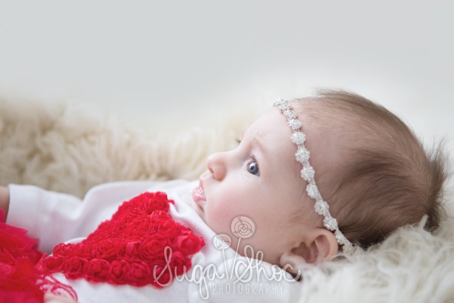 baby photograph with sleepy shimmer hair tie for valentine's day mini session in bucks county pa