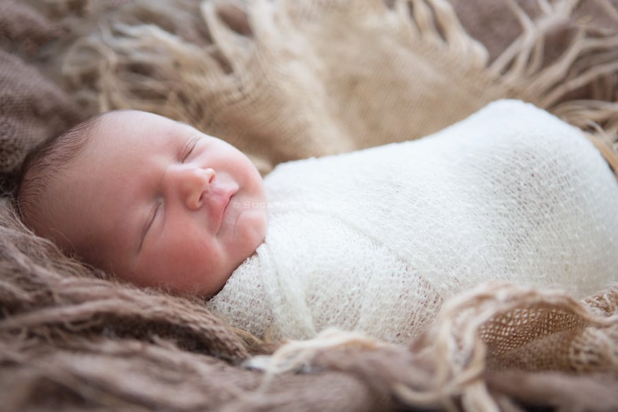 SugaShoc_Photography_Newborn_Photographer_Bucks_County_PA_Doylestown_PA_newborn_smile_in_nest