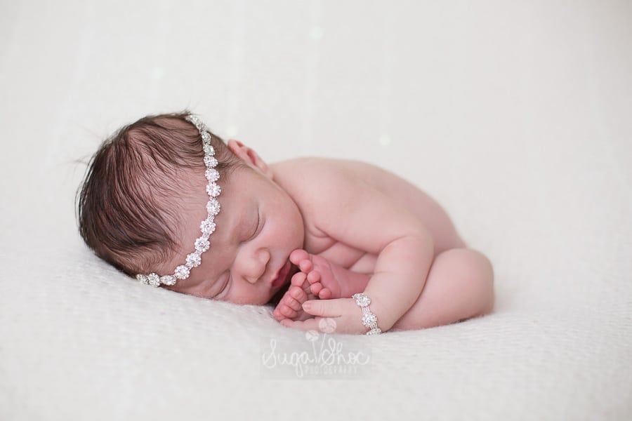 SugaShoc_Photography_Newborn_Photographer_Bucks_County_PA_Doylestown_PA_sleepy_shimmer_tieback_and_bracelet_on_newborn