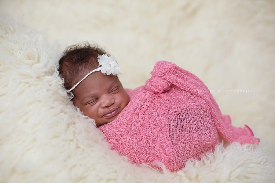 SugaShoc_Photography_Newborn_Photographer_Bucks_County_PA_Doylestown_PA_newborn_smile_wrapped_flokati
