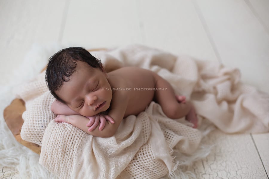 SugaShoc_Photography_Newborn_Photographer_Bucks_County_PA_Doylestown_PA_newborn_laying_on_arms_crossed_posing_ideas