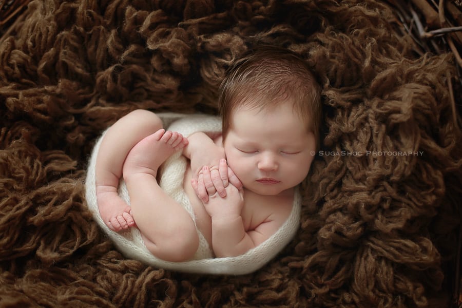 SugaShoc_Photography_Newborn_Photographer_Bucks_County_PA_Doylestown_PA_newborn_posing_ideas_newborn_with_knitted_wrap_curled_up