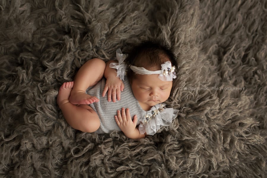 SugaShoc_Photography_Newborn_Photographer_Bucks_County_PA_Doylestown_PA_baby_in_fluffy_rug_newborn_posing_ideas