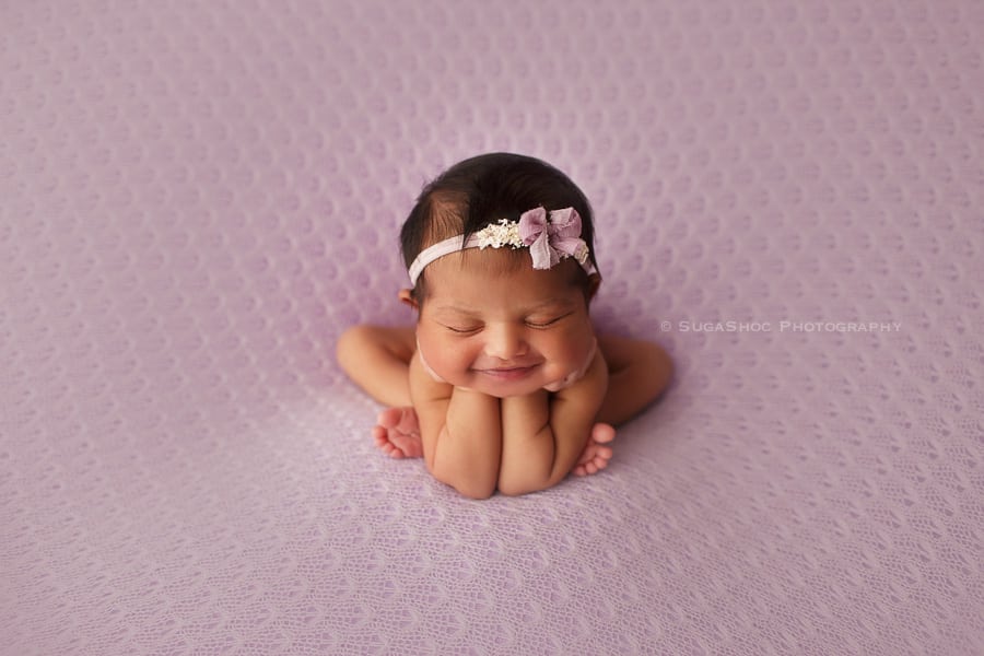 newborn baby girl smiling froggy pose sugashoc_photography_newborn_photographer_bucks_county_pa_doylestown_pa