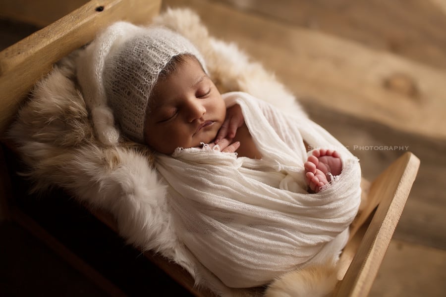 newborn baby in a bed sugashoc_photography_newborn_photographer_bucks_county_pa_doylestown_pa