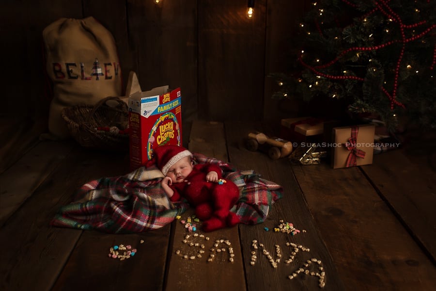 SugaShoc_Photography_Newborn_Photographer_Bucks_County_PA_Doylestown_PA_newborn_elf_on_the_shelf_playing_with_cereal_lucky_charms