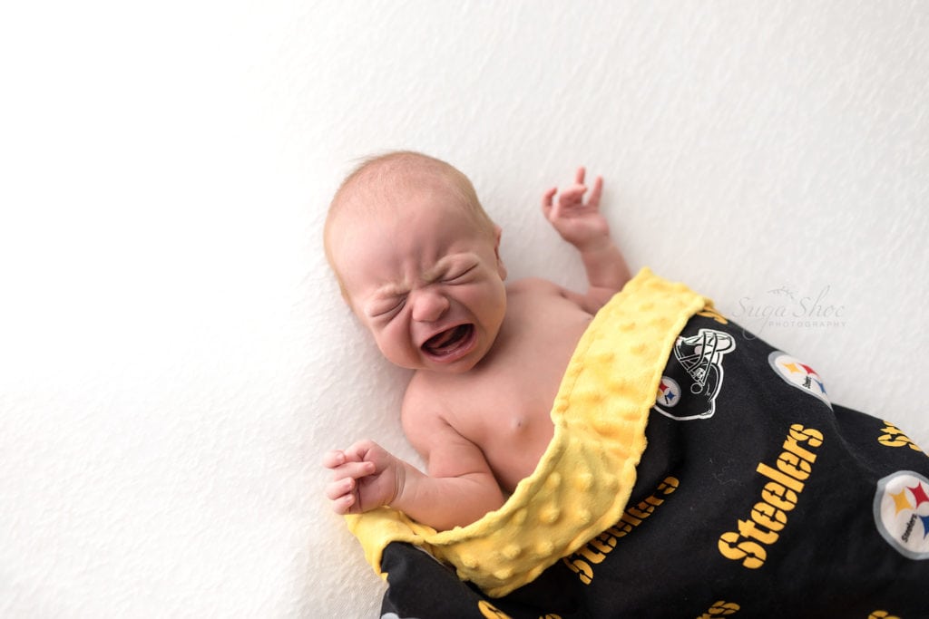 SugaShoc Photography Newborn Photographer Bucks County PA Doylestown PA Baby Hunter Newborn Session crying with Steelers blanket