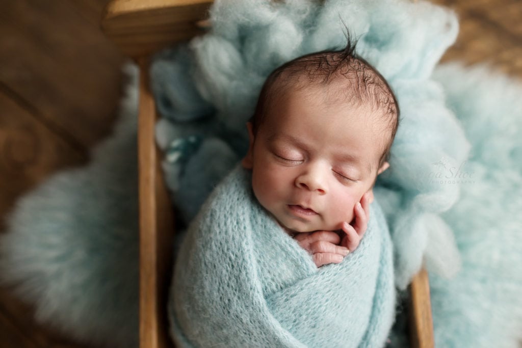SugaShoc Photography Newborn Photography Bucks County PA Doylestown PA Newborn Twin Photographer baby boy sleeping in wooden bed wrapped in light blue wrap
