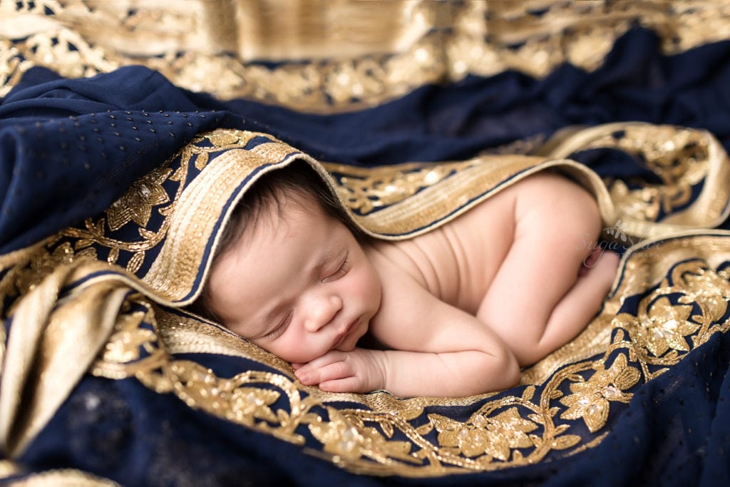 SugaShoc Photography Newborn Photography Bucks County PA Doylestown PA Newborn Photographer Sari Newborn Session baby sleeping in blue and gold Indian sari
