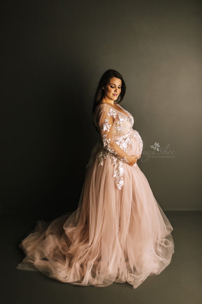 SugaShoc Photography Twin Maternity Session Bucks County PA Doylestown PA Maternity Photographer Maternity pose wearing pink tulle maternity dress holding belly looking down