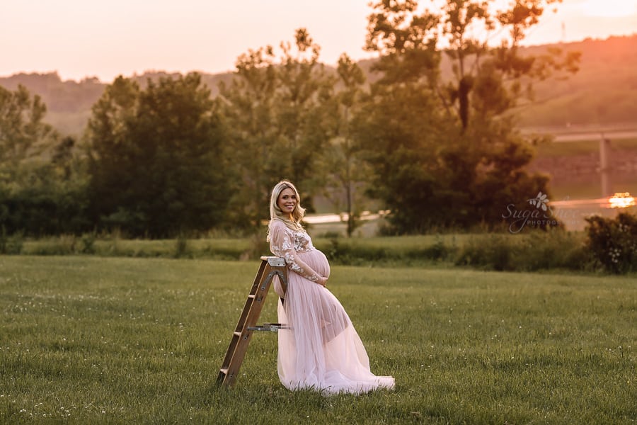 Sugashoc Photography Doylestown Maternity Photographer mommy-to-be leaning on stool in field