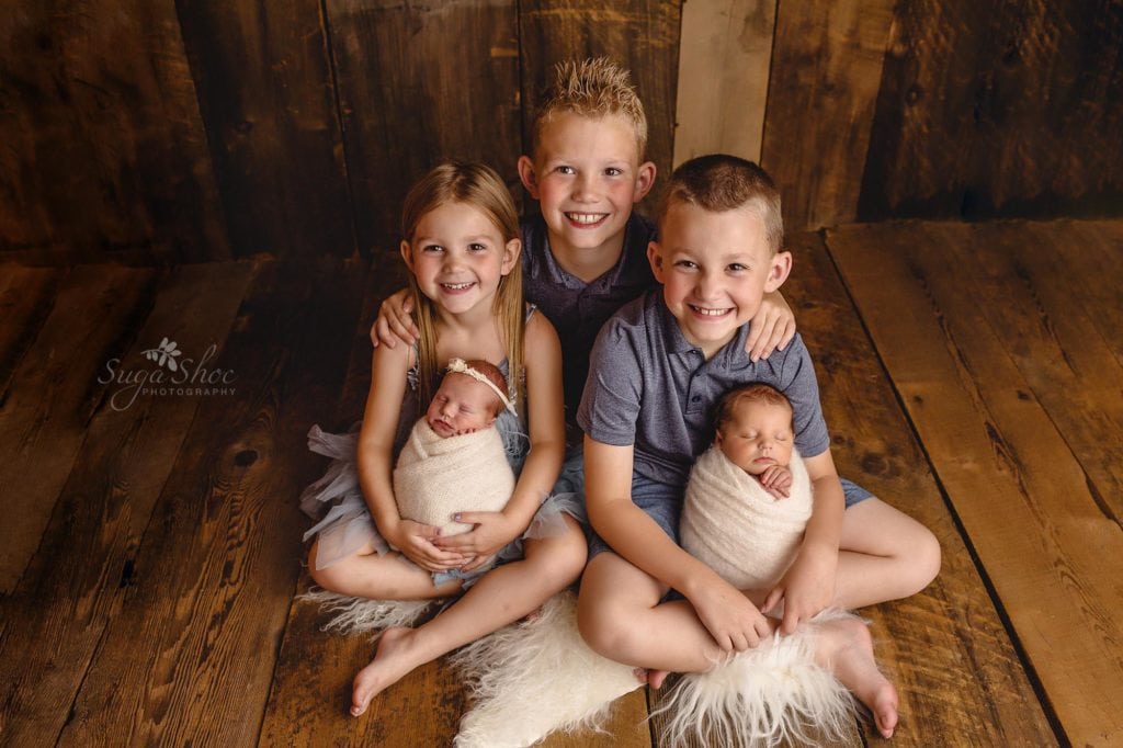 Sugashoc Photography Montgomery County Newborn Photographer children pose with baby brother and sister