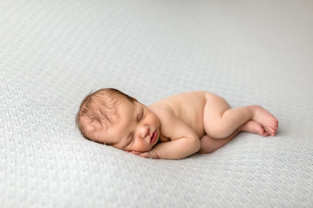 Sugashoc Photography Montgomery County Newborn Photographer baby boy sleeping on blue blanket