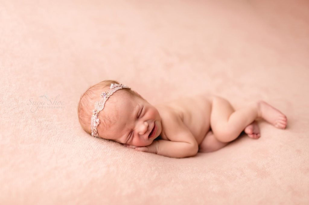 Sugashoc Photography Montgomery County Newborn Photographer baby girl sleeping on pink blanket