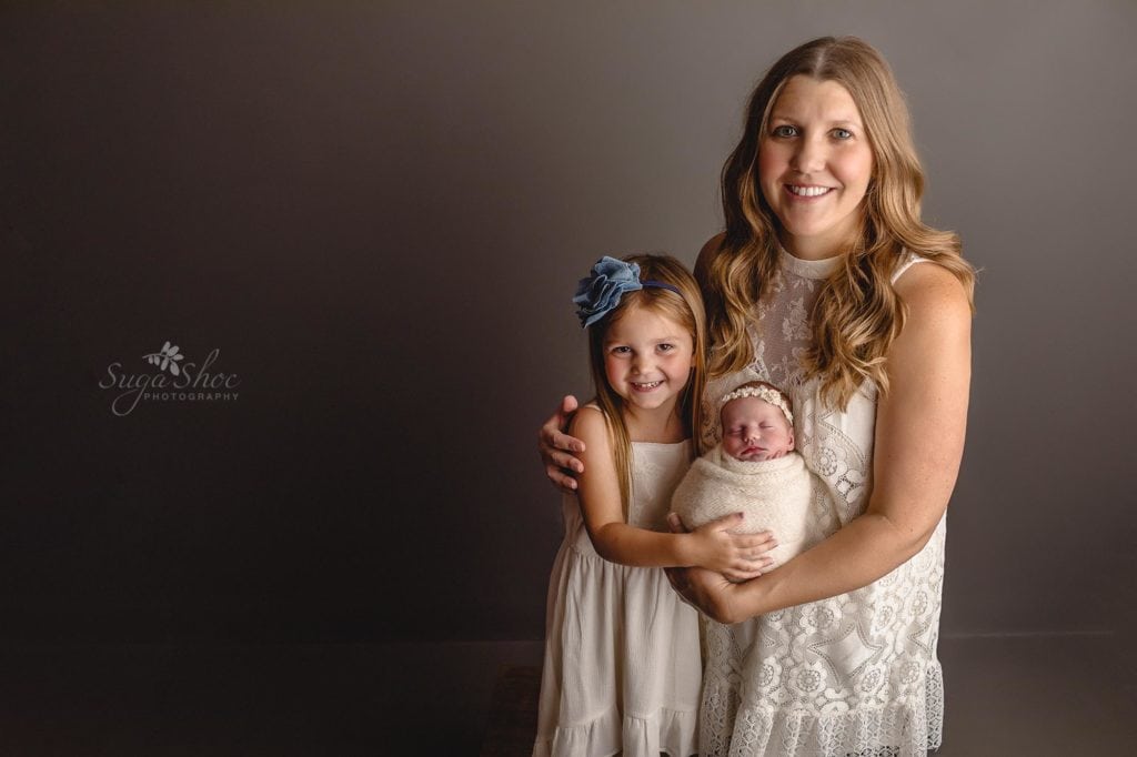 Sugashoc Photography Montgomery County Newborn Photographer girl family pose with newborn daughter