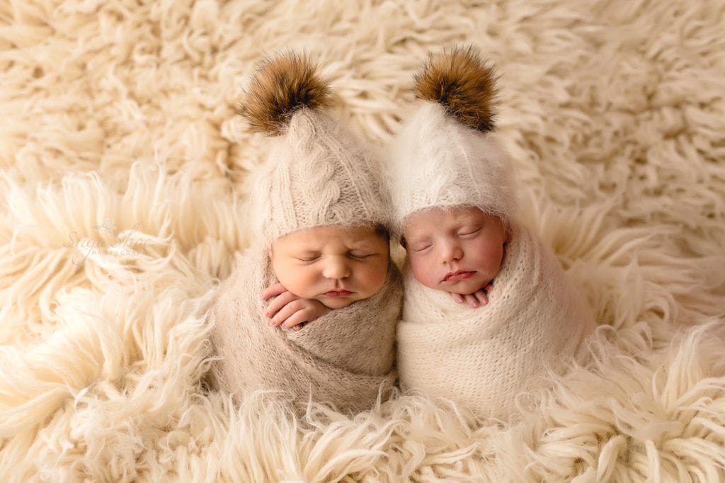 Sugashoc Photography Montgomery County Newborn Photographer twins wrapped in cream with knit hats with pompoms