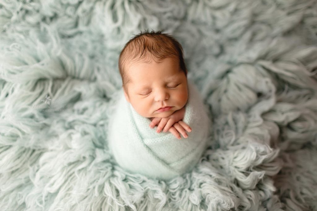 Sugashoc Photography Montgomery County Newborn Photographer baby boy wrapped in blue sleeping