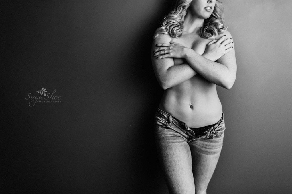 Sugashoc Photography Fiance Boudoir wearing open jeans arms crossing chest in black-and-white