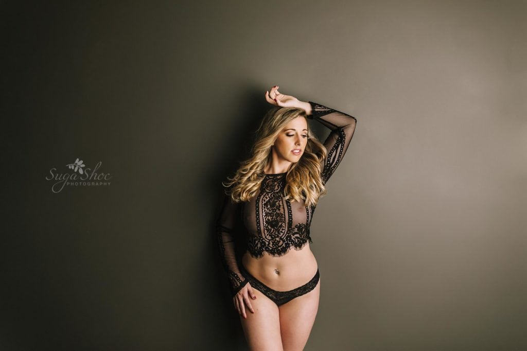 Sugashoc Photography Fiance Boudoir standing against wall wearing black lace top