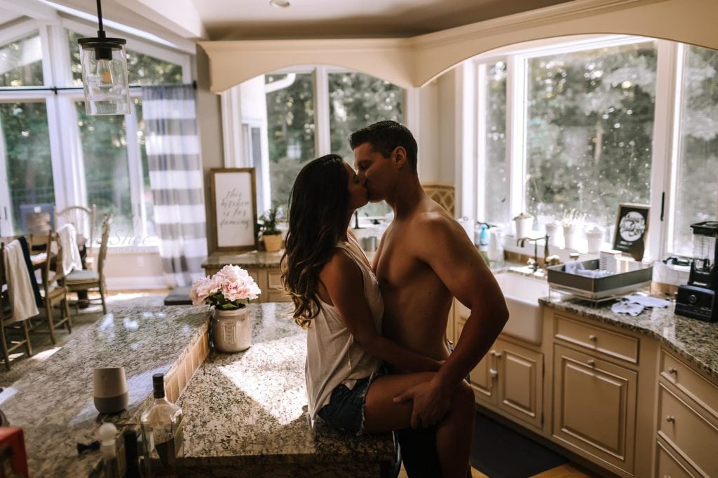 Philadelphia Couples Boudoir Photographer couple kissing in the kitchen