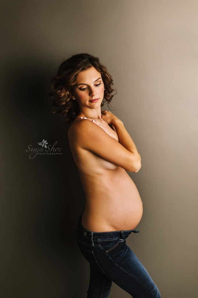 Philadelphia Maternity Boudoir Photographer SugaShoc Photography pregnant woman wearing unbottoned jeans with arms across chest