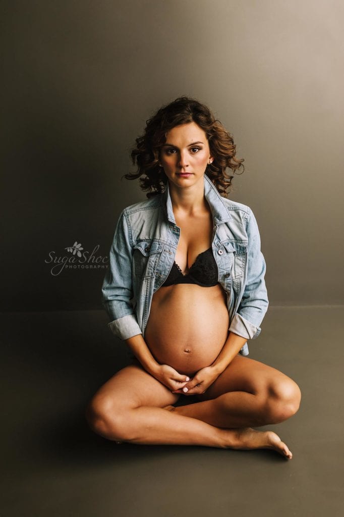 Philadelphia Maternity Boudoir Photographer SugaShoc Photography pregnant woman sitting wearing jean jacket and black bra