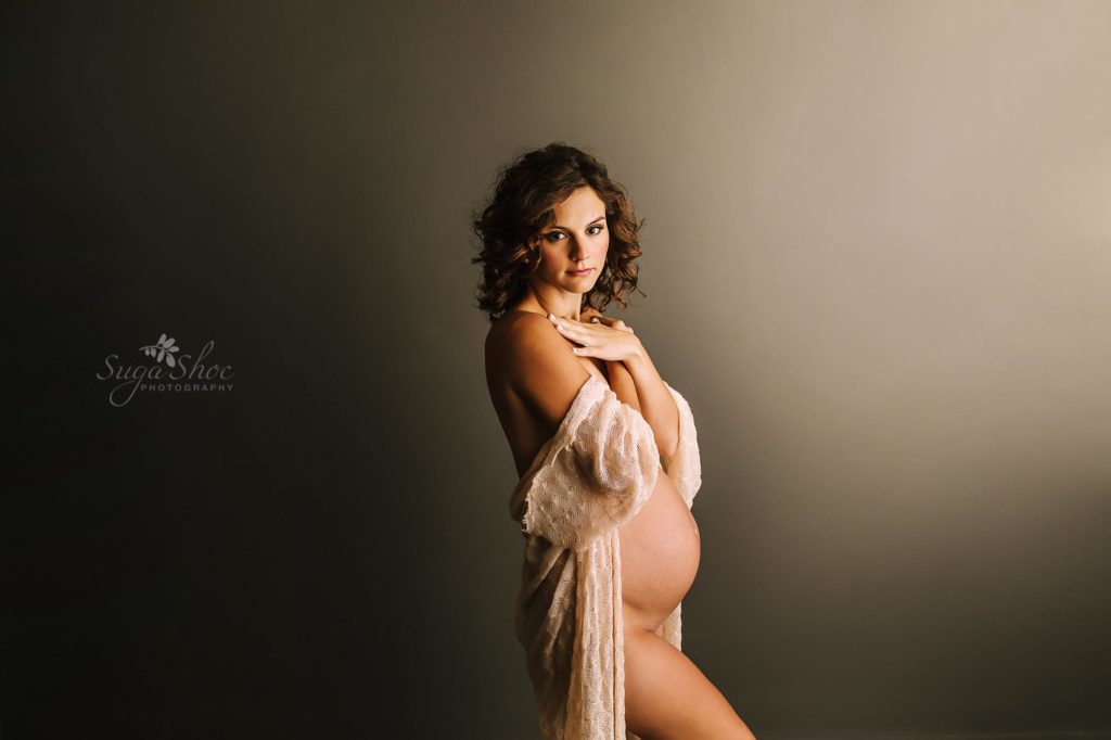 Philadelphia Maternity Boudoir Photographer SugaShoc Photography pregnant woman naked with cream wrap draped over arms