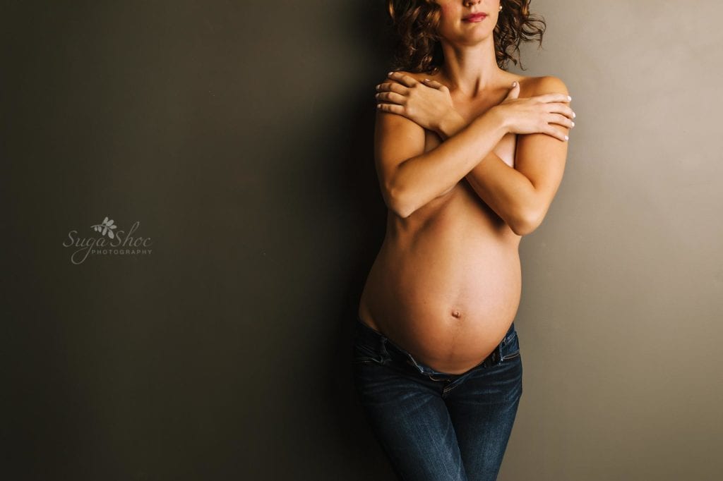 Philadelphia Maternity Boudoir Photographer SugaShoc Photography pregnant woman wearing open jeans and arms across chest