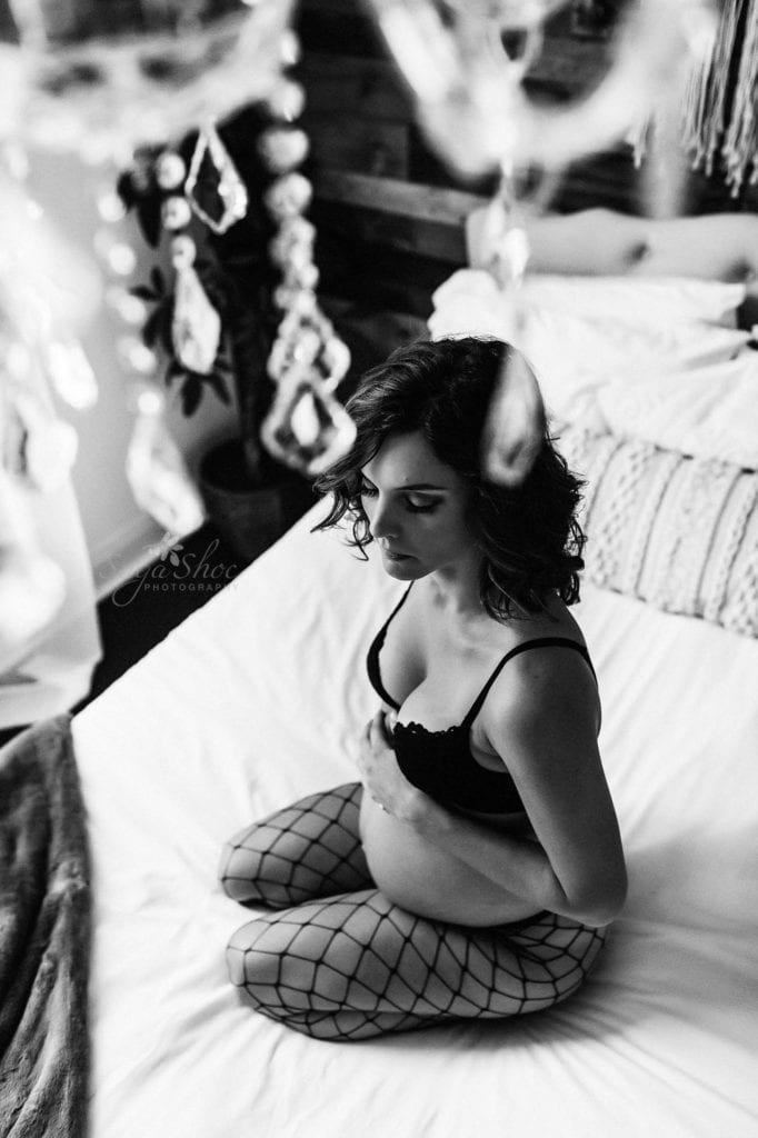 Philadelphia Maternity Boudoir Photographer SugaShoc Photography pregnant woman wearing fishnet tights and black lace bra