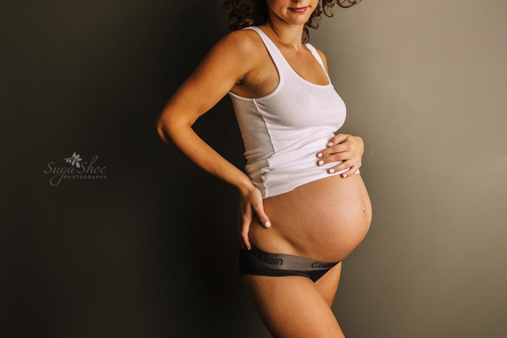 Philadelphia Maternity Boudoir Photographer SugaShoc Photography pregnant woman wearing white top and black underwear