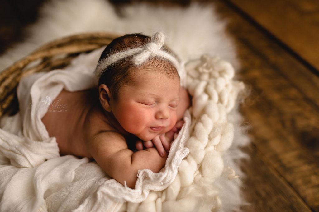 SugaShoc Photography Neutral Newborn Photo Session, white fuzzy rug with white headband