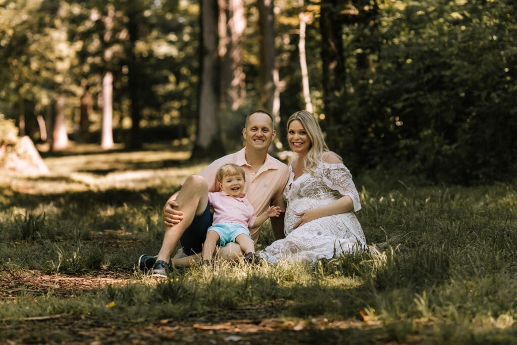 portrait photography, family seated in grass