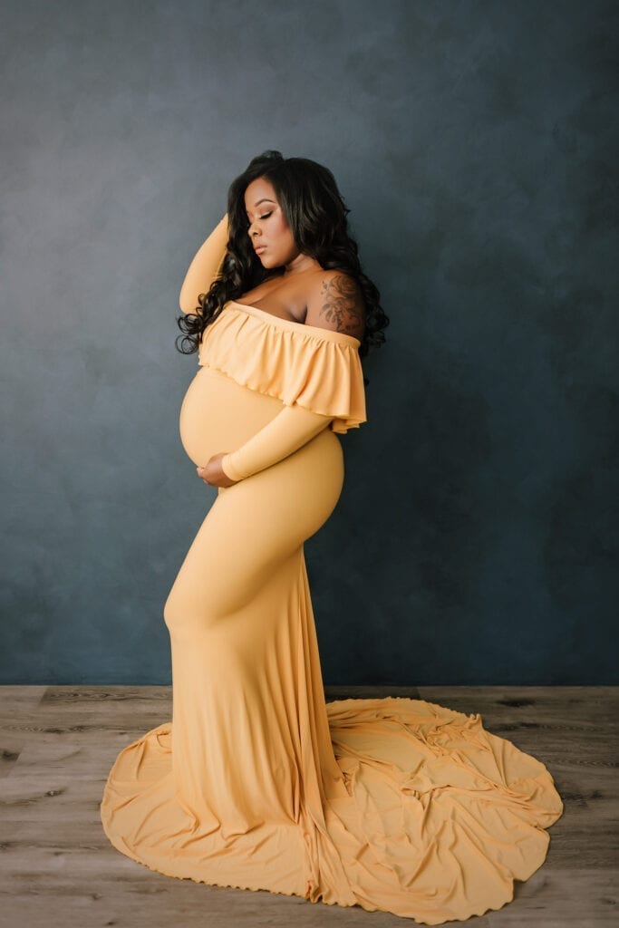 professional maternity photography near me bucks county pa, woman in flowing yellow maternity gown