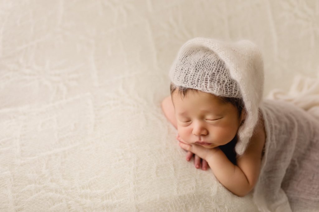 Newborn baby boy photoshoot in studio.