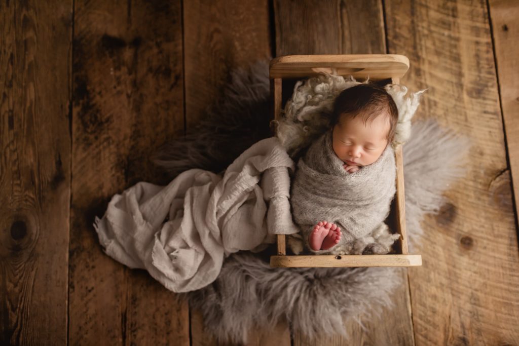 Newborn baby boy photoshoot in studio.