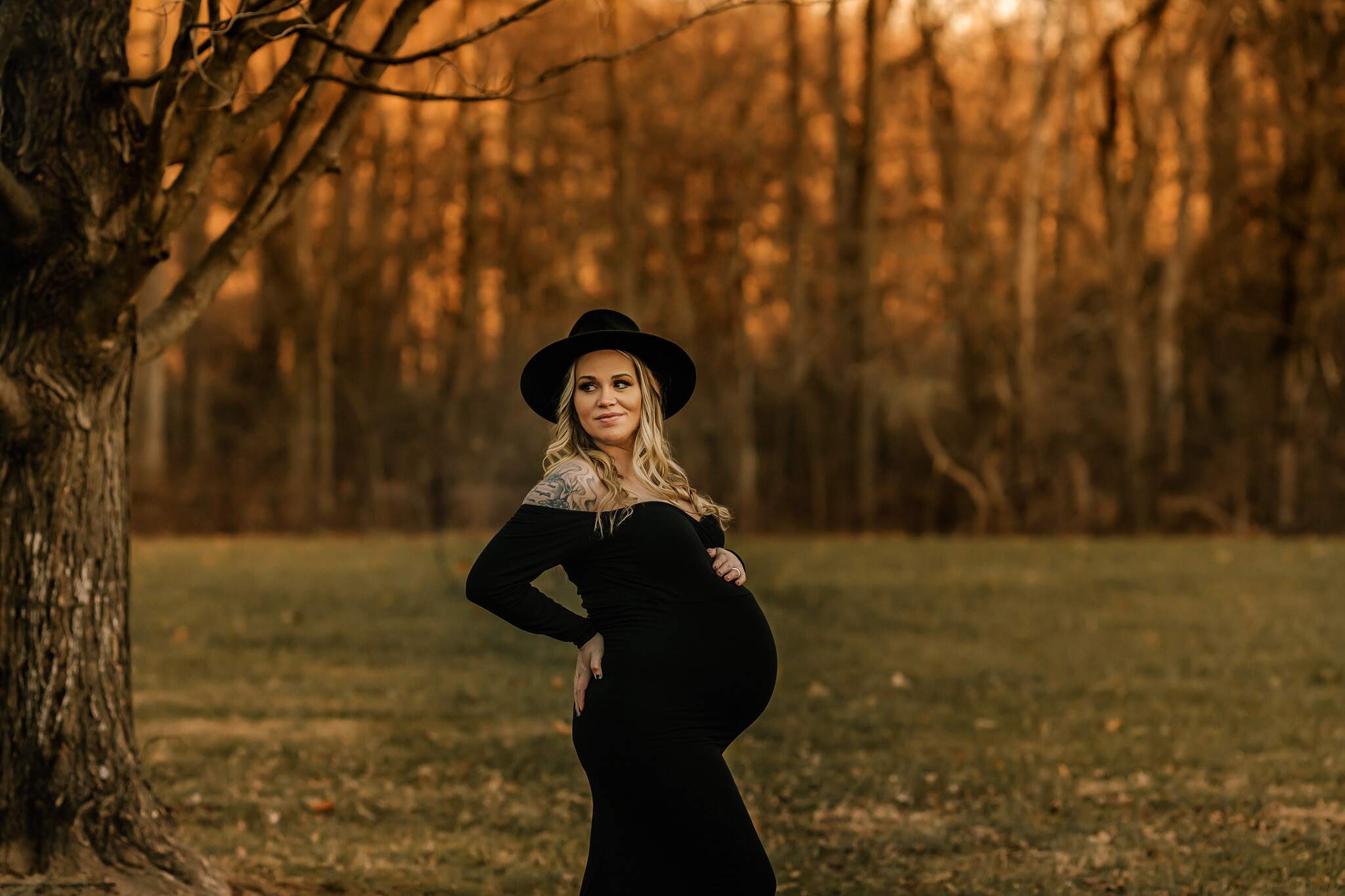 outdoor winter maternity session in black dress